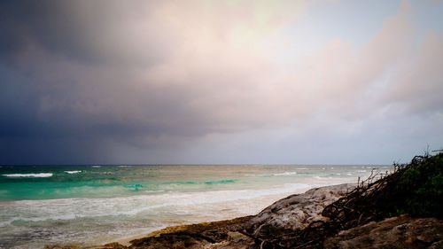 Scenic view of sea against cloudy sky