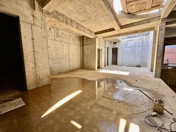 High angle view of man standing in abandoned building