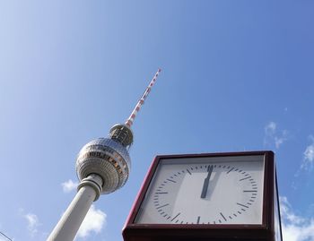 Low angle view of clock tower against sky