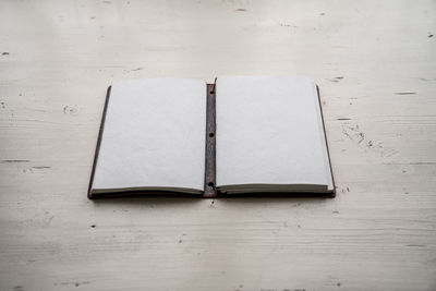 High angle view of open book on table