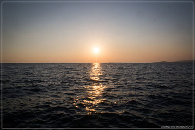 Scenic view of sea at sunset