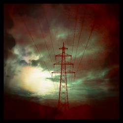 Low angle view of electricity pylon against sky