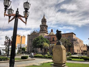 People walking in front of church at san luis potosi