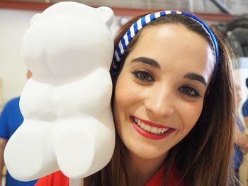 Close-up portrait of a smiling young woman