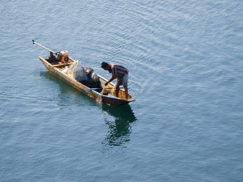 Fishermen catch fish with nets in the wadaslintang reservoir