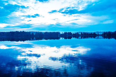 Reflection of trees in calm lake