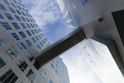 Low angle view of modern buildings against sky