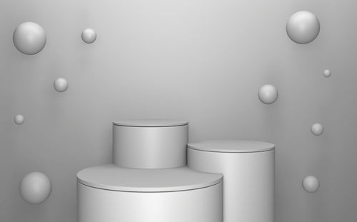 Close-up of electric lamp on table against wall