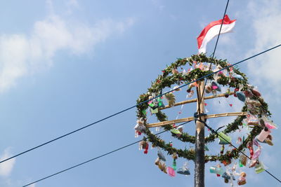 Low angle view of christmas decorations against sky