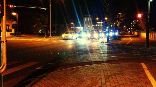 Cars on road at night