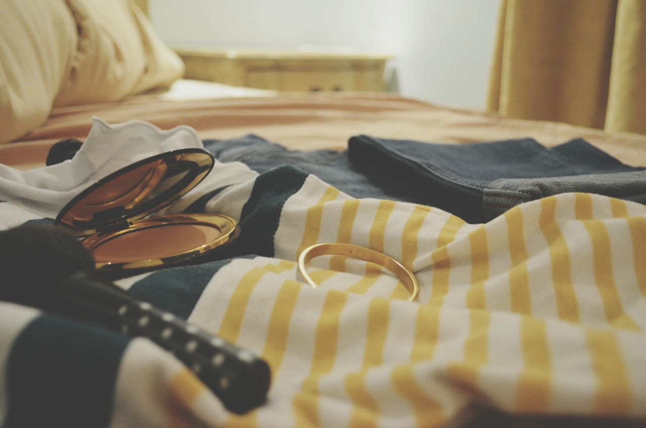 indoors, home interior, bed, selective focus, relaxation, person, low section, close-up, chair, bedroom, lifestyles, focus on foreground, music, part of, table, domestic life, musical instrument