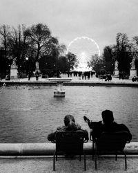 Man sitting on bench in park