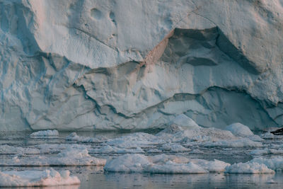 Close-up of icebergs against mountain