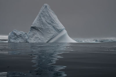 Iceberg in front of a glacier on low island, antarctica.