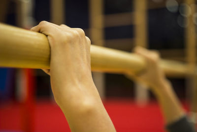 Cropped hand holding gymnastics equipment