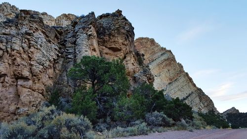 Low angle view of rock formation against sky