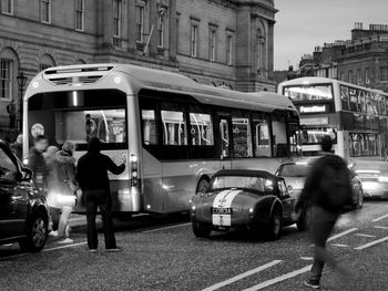 People walking on road in city