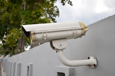 Close-up of security camera mounted on wall