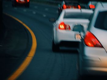 Blurred motion of car on road in city