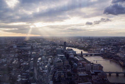 Cityscape against cloudy sky