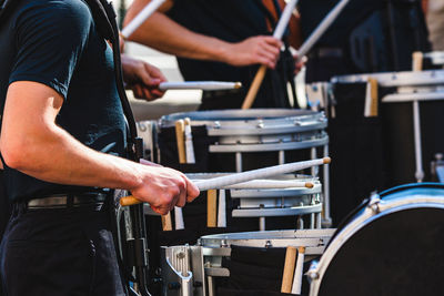 A portion of the marching band drum line performing