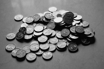 High angle view of coins on table