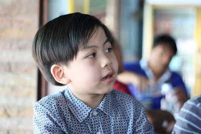 Close-up of boy looking away