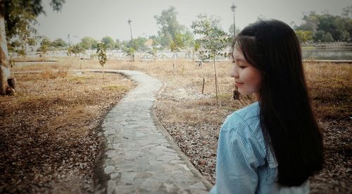 Close-up of girl against water