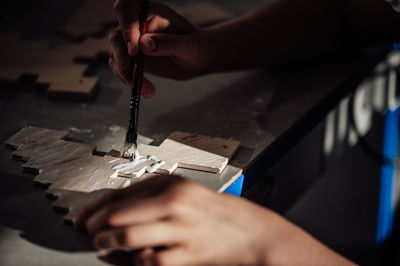 Cropped hand of person working in workshop
