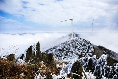 Scenic view of snow covered mountains against sky