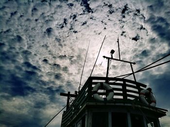 Low angle view of silhouette building against sky
