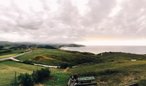 Scenic view of sea against cloudy sky