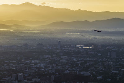 Aerial view of city at sunset