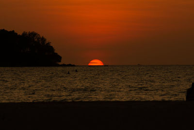 Scenic view of sea against romantic sky at sunset