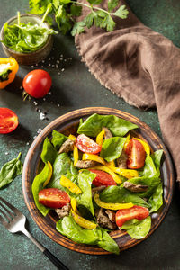 High angle view of salad in bowl on table