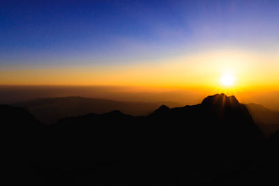 A stunning sunset or sunrise scene of silhouette mountain peaks captured at chiangmai, thailand