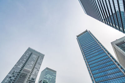 Low angle view of modern buildings against clear sky