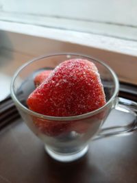 Close-up of strawberry in glass on table