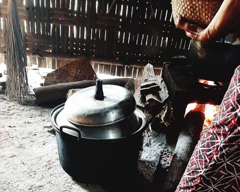 Midsection of person preparing food in kitchen