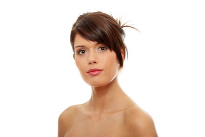 Portrait of a serious young woman over white background