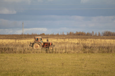 Bicycle on field against sky