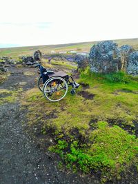 Bicycle on mountain against sky