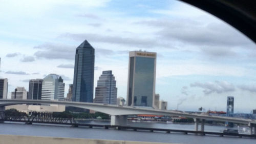 City skyline against cloudy sky