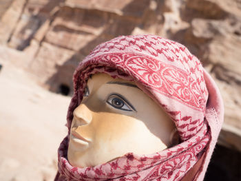 Close-up portrait of woman wearing hat