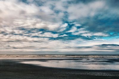 Scenic view of beach against sky