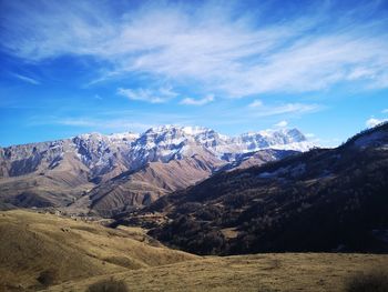 Scenic view of snowcapped mountains against sky