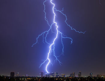 Lightning strikes behind the phoenix, arizona skyline