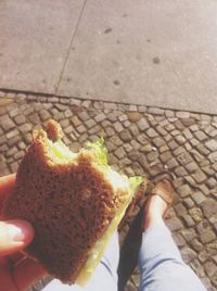 Cropped image of person eating food