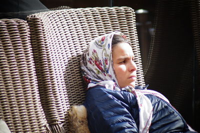 Woman wearing warm clothing looking away outdoors