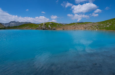 Scenic view of lagoon against blue sky